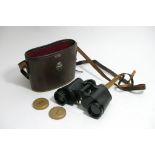 A Pair of binoculars maker GreenCat in a leather c