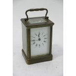 A Brass cased carriage clock with a rectangular en