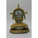 A Fine French gilt and porcelain clock set with se