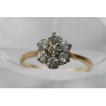 An 18ct gold diamond cluster ring.