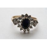 A 9ct gold, sapphire and diamond cluster ring.