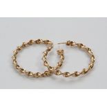A pair of 9ct gold hand twisted hoop earrings