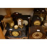 A collection of six mantel clocks including alabas