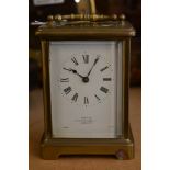 A brass case carriage clock, the enamel dial with Roman numerals, Mappin and Webb