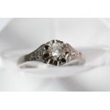 A white gold or platinum solitaire diamond ring