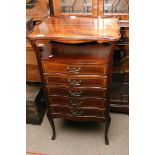 An Edwardian inlaid music cabinet with serpentine