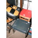 A small perspex topped table, retro red stool, an