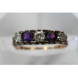 A Diamond and amethyst ring.