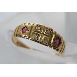 An 18ct gold ring set with diamonds and rubies.