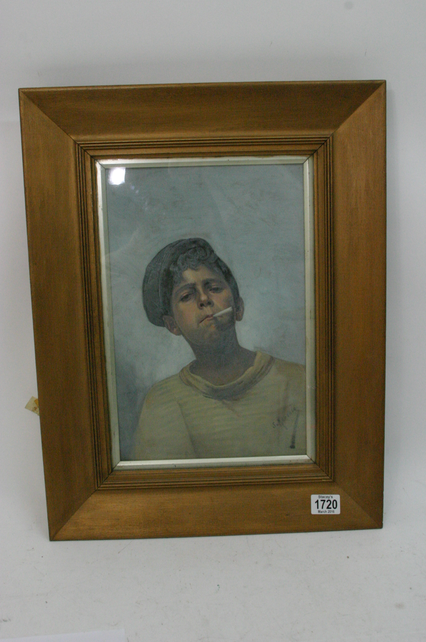 A framed oil painting on canvas study of of a boy smoking a cigarette. Indistinctly signed lower