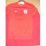 1966 England World Cup Signed Shirts: Childs size Umbro red 1966 style shirt signed at paid