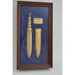 A framed Tutankhamun Franklin mint replica dagger