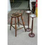 An elm seated stool and two smoker's stands.