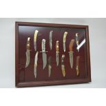 A framed Franklin mint replica set of hunting kniv
