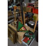 A collection of vintage snooker balls and cues to