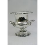 A silver plated urn shaped champagne bucket