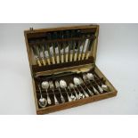 An oak canteen of cutlery