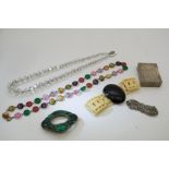 A small bag of costume jewellery and a Dupont ligh
