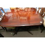 A reproduction mahogany table and four matching chairs