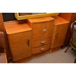 An Art Deco style dining room suite comprising a sideboard, table and a set of chairs.