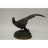 A painted bronze figure of a pheasant.