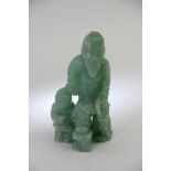 A small oriental carved Jadite fgure of an man and child, some chips