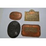 Four small reproduction wall plaques