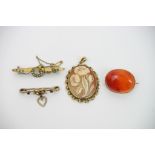 A cameo pendant and three Edwardian brooches