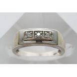 A 9ct white gold three stone ring.