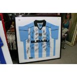 A framed and glazed signed Coventry City football shirt. A framed and glazed signed Aston Villa