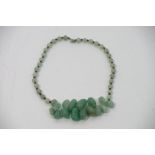 A polished jade type choker necklace