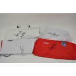 A collection of 4 signed England football shirts i