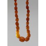 A graduated amber bead necklace, approx 31g, largest bead 2cm