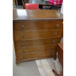 A Walnut chest of drawers fitted with five drawers on cabriole legs pad feet