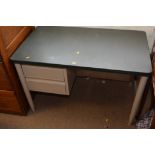 A metal two drawer office desk