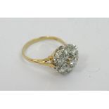 A ladies 18ct seven stone cluster ring, white and