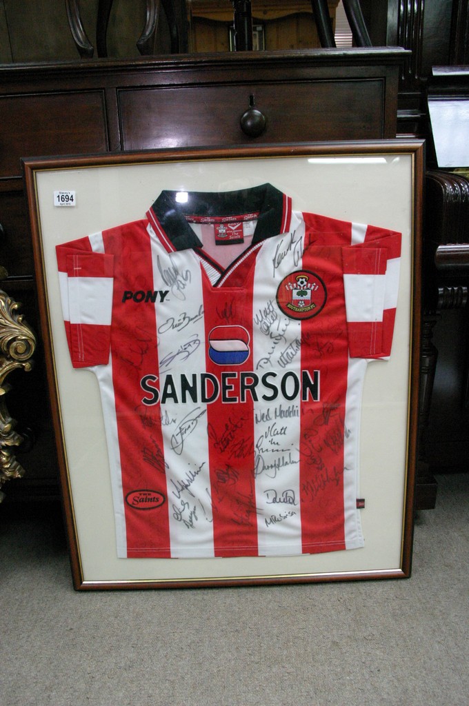 A framed and signed football shirt for Southampton