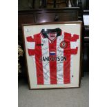 A framed and signed football shirt for Southampton