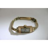 A 9ct gold Art Deco style watch with applied metal