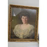 A gilt framed oil painting of a lady.