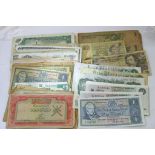 A collection of British bank notes, some consecuti