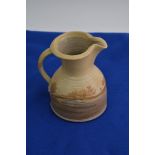 A Contemporary studio art pottery jug, decorated with landscape views stamped and attributed to