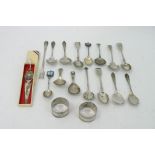 A collection of silver spoons napkin rings