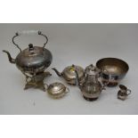A collection of silver plated items to include a spirit kettle on stand, tea service items etc.