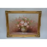 A gilt framed oil on canvas of a still life of flowers by Robert Cox.