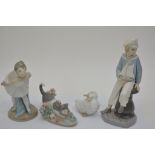 A Lladro figure of a sailor boy, Lladro cat, A Nao