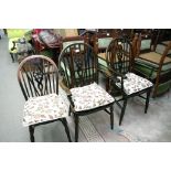 A set of six Windsor style chairs