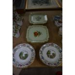 A collection of twelve hand painted plates including six square hand painted plates and six round
