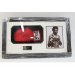 A box-framed and signed Thomas "Hitman" Hearns boxing glove