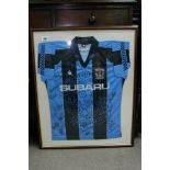 A framed and signed football shirt for Coventry